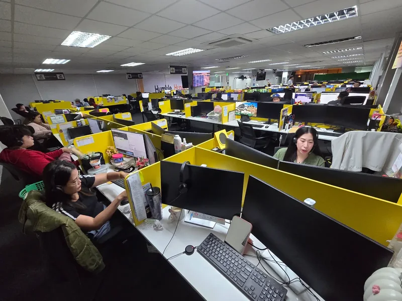 Staff working at dedicated desks in KamelBPO’s Clark office.